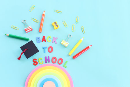 education and back to school concept. stationery over blue background. top view, flat layの写真素材