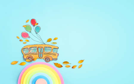 Back to school concept. Top view image of school bus over blue background