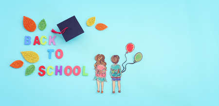 Back to school concept. Top view image of two kids over blue backgroundの写真素材