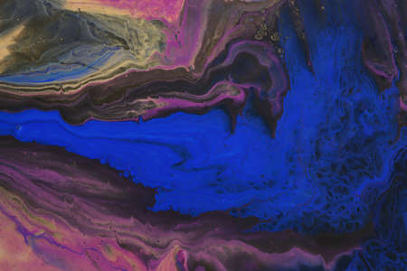art photography of abstract marbleized effect background. Blue, black, purple and gold creative...