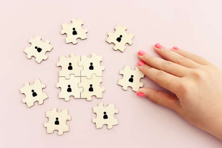 business concept image of puzzle blocks with people icons ,human resources and management conceptの写真素材