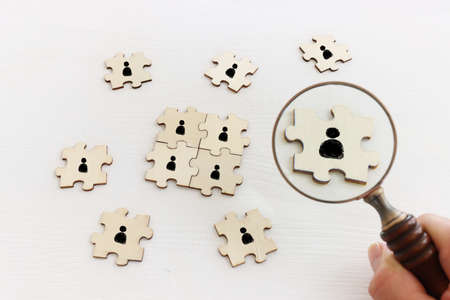 business concept image of puzzle blocks with people icons ,human resources and management conceptの写真素材