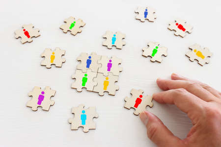 business concept image of puzzle blocks with people icons ,human resources and management conceptの写真素材