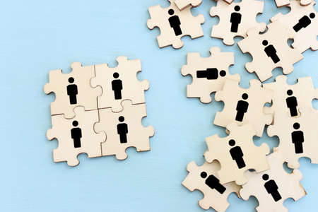 business concept image of puzzle blocks with people icons ,human resources and management conceptの写真素材