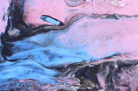 art photography of abstract marbleized effect background with pink, light purple, black and blue creative colors. Beautiful paint.の写真素材