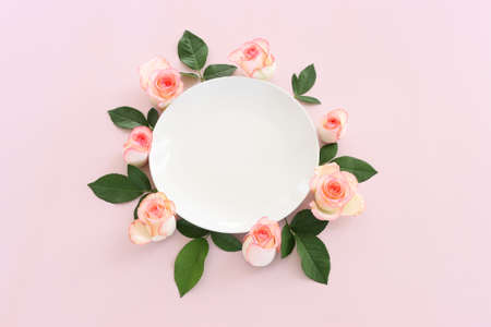 Pastel delicate background with pink roses and petals. Top viewの写真素材