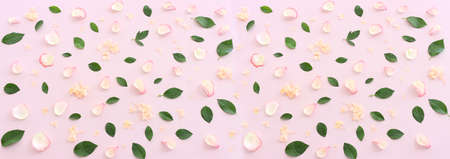 Pastel delicate background with pink roses and petals. Top viewの写真素材