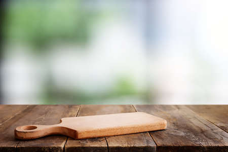 empty table board and defocused indoor background. product display concept