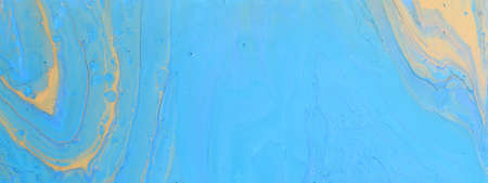 art photography of abstract marbleized effect background with blue and yellow creative colors....