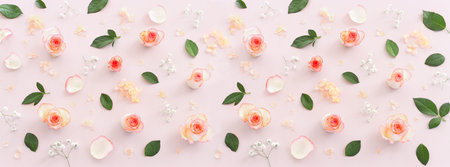 Pastel delicate background with pink roses and petals. Top view