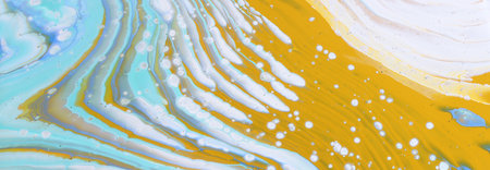 art photography of abstract marbleized effect background with white, blue and yellow reative colors....