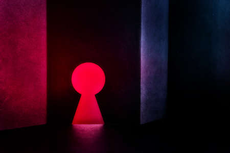 abstract textured wall with keyhole dark neon lightsの写真素材