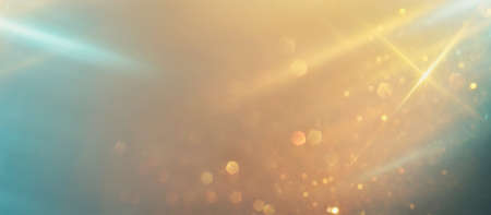 glitter vintage lights background. silver, blue, gold and white. de-focused