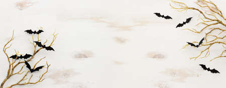 top view image of Halloween holoday. bare trees, bats over white wooden backgroundの写真素材