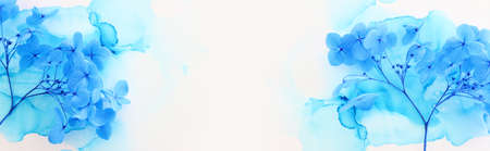 Creative image of blue Hydrangea flowers on artistic ink background. Top view with copy space