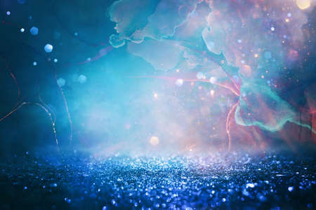 abstract red, blue, gold and black defocused background. bokeh lightsの写真素材