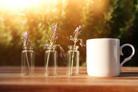 Tea cup on wooden table outdoorsの写真素材