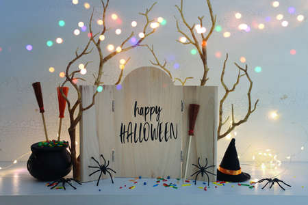 holidays image of Halloween. spiders, bare trees and wooden board frame with textの写真素材