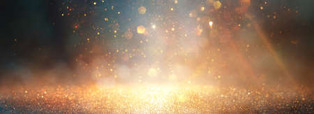 background of abstract glitter lights. gold, blue and black. de focusedの写真素材