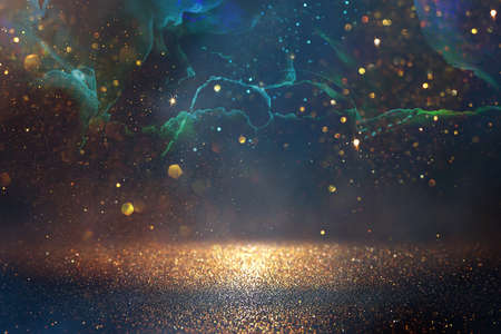 background of abstract glitter lights. gold, blue and black. de focusedの写真素材