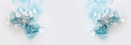 Creative image of pastel blue Hydrangea flowers on artistic ink background. Top view with copy spaceの写真素材
