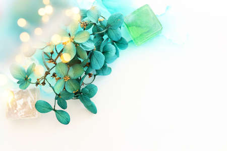 Creative image of emerald and green Hydrangea flowers on artistic ink background. Top view with copy spaceの写真素材