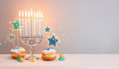 Religion image of jewish holiday Hanukkah background with menorah (traditional candelabra), doughnut and candlesの写真素材