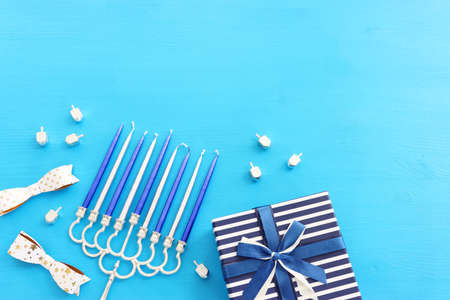 Religion image of jewish holiday Hanukkah background with menorah (traditional candelabra), spinning...