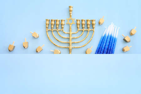 Religion image of jewish holiday Hanukkah background with menorah (traditional candelabra), spinning top and candlesの写真素材