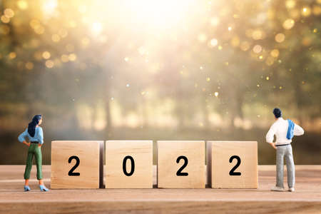 wooden cubes with the text 2022 over bright shiny background