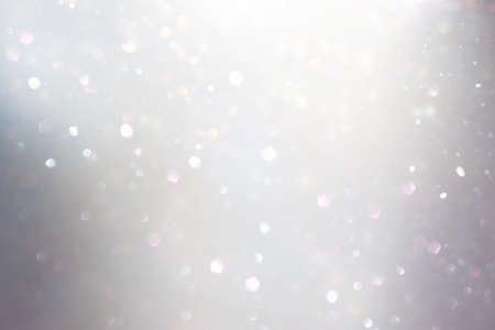 background of abstract gold and silver glitter lights. defocused