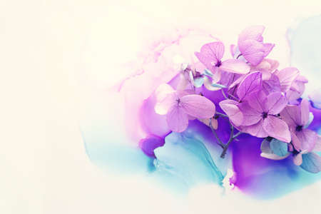 Creative image of pink and purple Hydrangea flowers on artistic ink background. Top view with copy spaceの写真素材