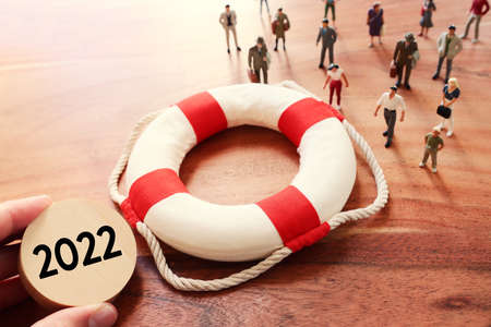 Concept image of life buoy protecting group of people. Rescue and support in times of crisis...
