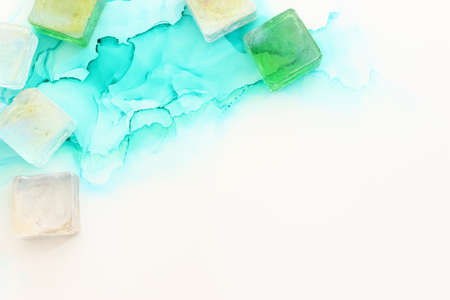 art photography of abstract fluid painting with alcohol ink, blue turquoise and gold colors. Paper textureの写真素材