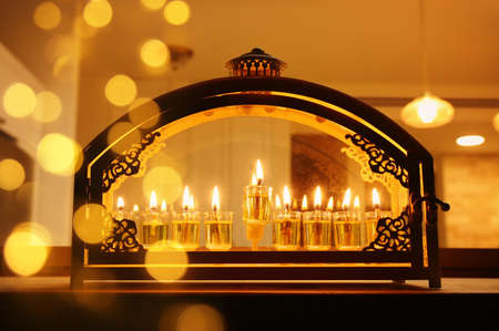 Religion image of jewish holiday Hanukkah background with menorah (traditional candelabra) and oil...