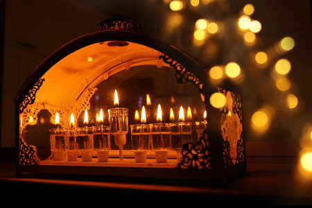 Religion image of jewish holiday Hanukkah background with menorah (traditional candelabra) and oil candlesの写真素材
