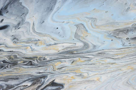 art photography of abstract marbleized effect background with gold, gray, black and white creative...