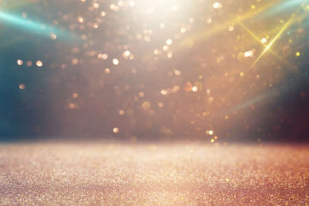 background of abstract gold and silver glitter lights. defocusedの写真素材