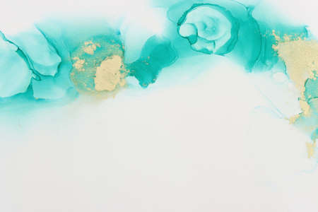 art photography of abstract fluid painting with alcohol ink, blue turquoise and gold colors. Paper...