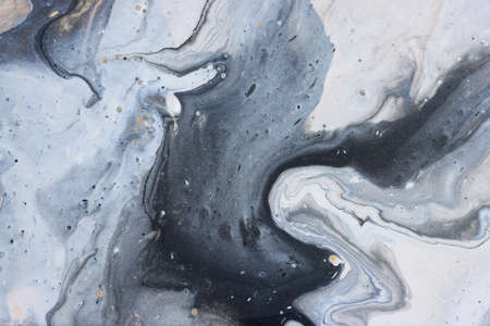 art photography of abstract marbleized effect background with gold, gray, black and white creative colors. Beautiful paint.の写真素材