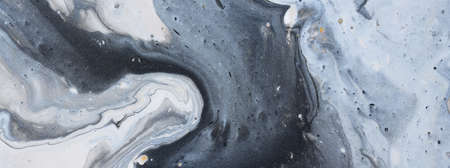 art photography of abstract marbleized effect background with gold, gray, black and white creative...
