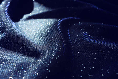Abstract image of satin fabric with bright glittersの写真素材