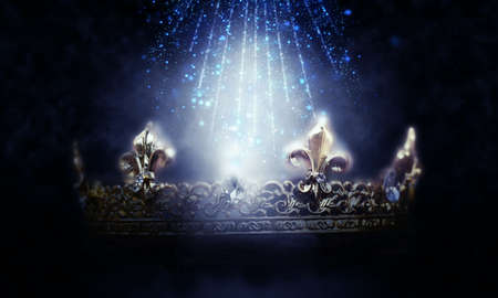 mysterious and magical photo of gold king crown over magical background. Medieval period concept.