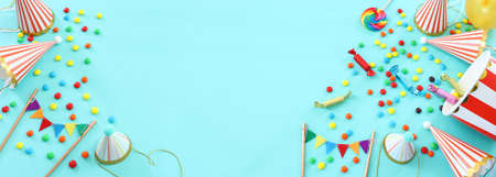 Party colorful image over blue background . Top view, flat layの写真素材