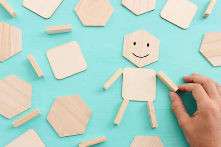 male hand holding cube with happy face. concept of happiness emotion and satisfactionの写真素材