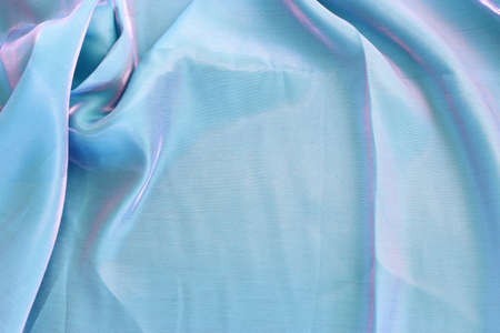 Pastel blue with pink light silk fabric texture backgroundの写真素材