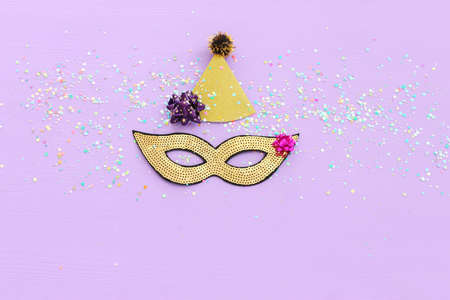 Holidays image of mardi gras masquarade sequins mask over purple background. view from aboveの写真素材