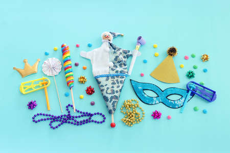 Purim celebration concept (jewish carnival holiday) over blue wooden backgroundの写真素材