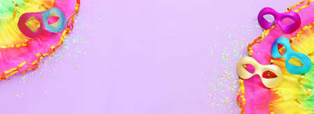 Holidays image of mardi gras masquarade masks over purple background. view from aboveの写真素材