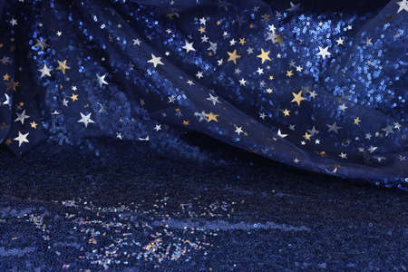 Dark blue with gold stars tulle chiffon texture backgroundの写真素材
